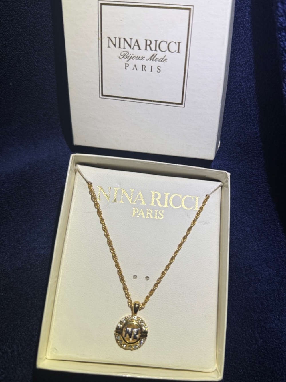 Nina Ricci Gold Logo Medallion Necklace
